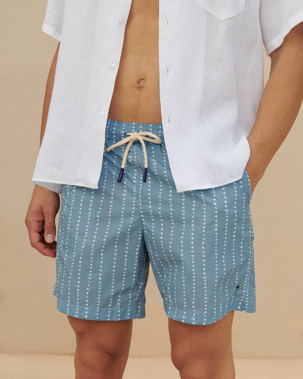 Manebí Printed Swim Shorts - Indigo with White Linear Triangles In vendita