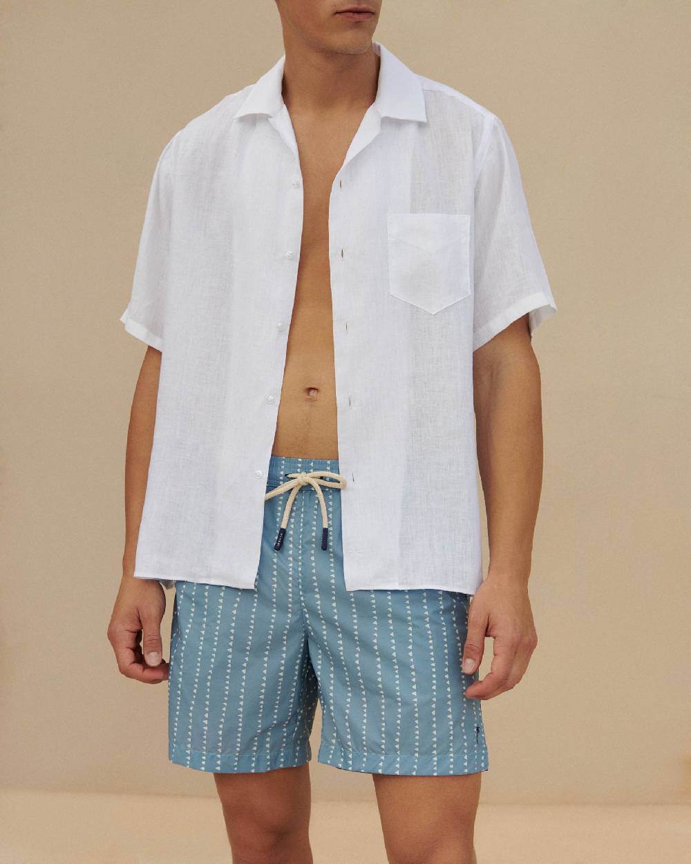 Manebí Printed Swim Shorts - Indigo with White Linear Triangles In vendita